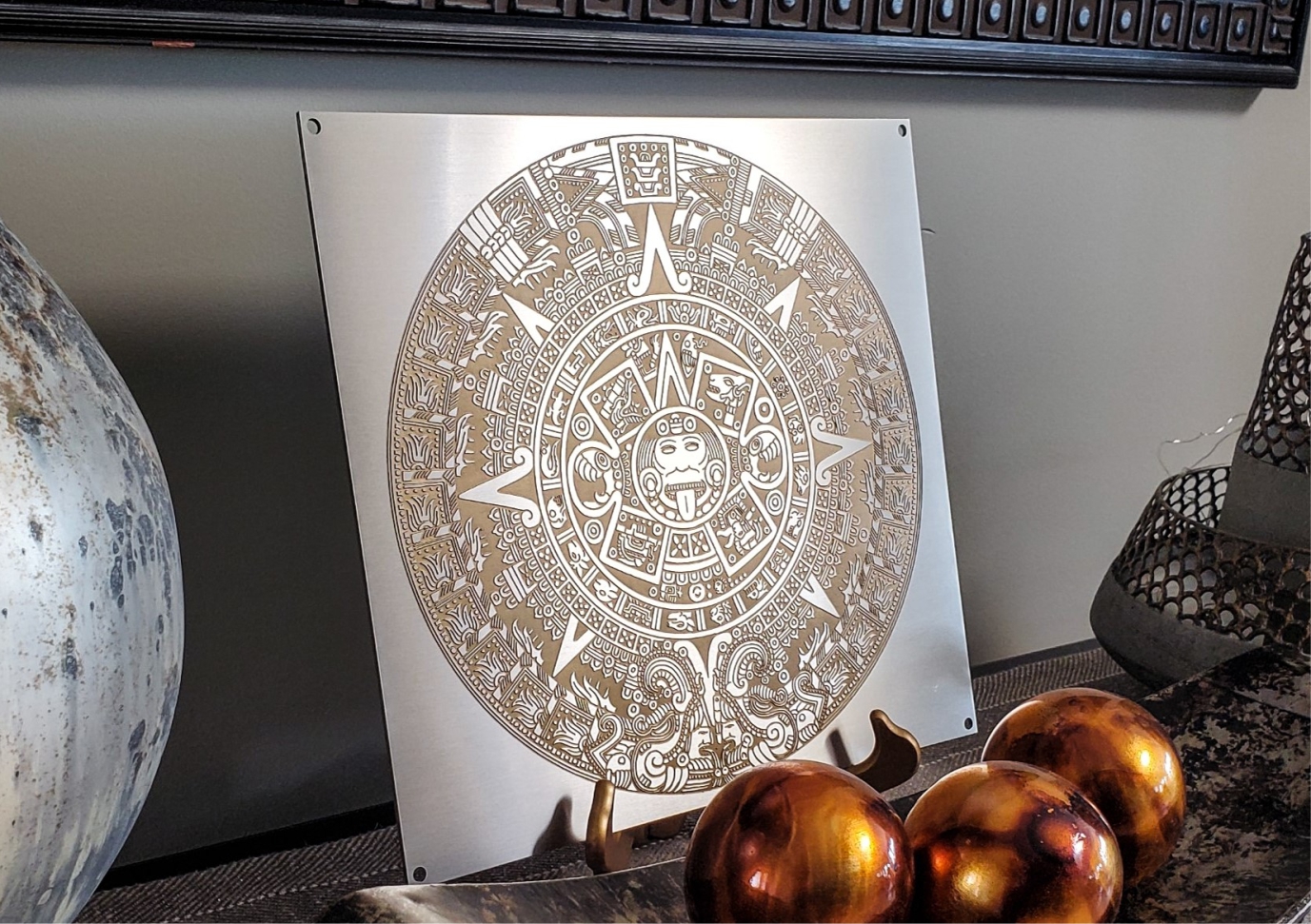 Mayan calendar painted with gold paint